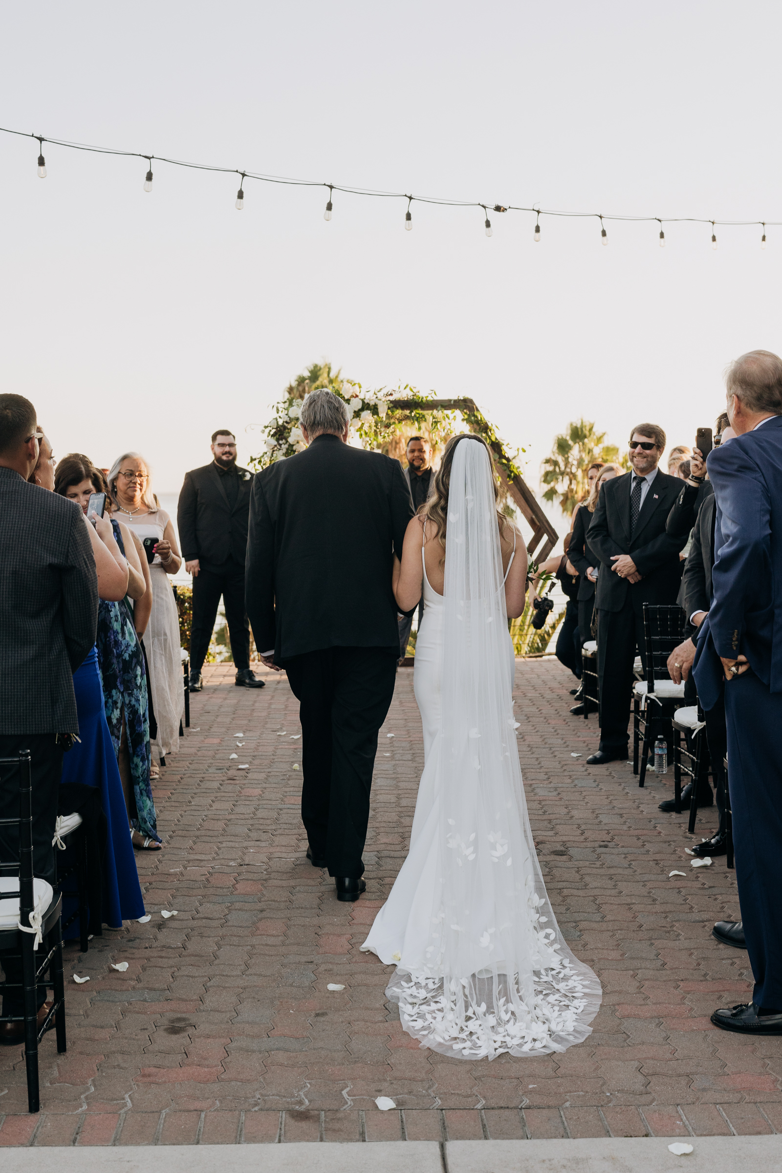 Bride walking down isle at Long Beach Museum of Art