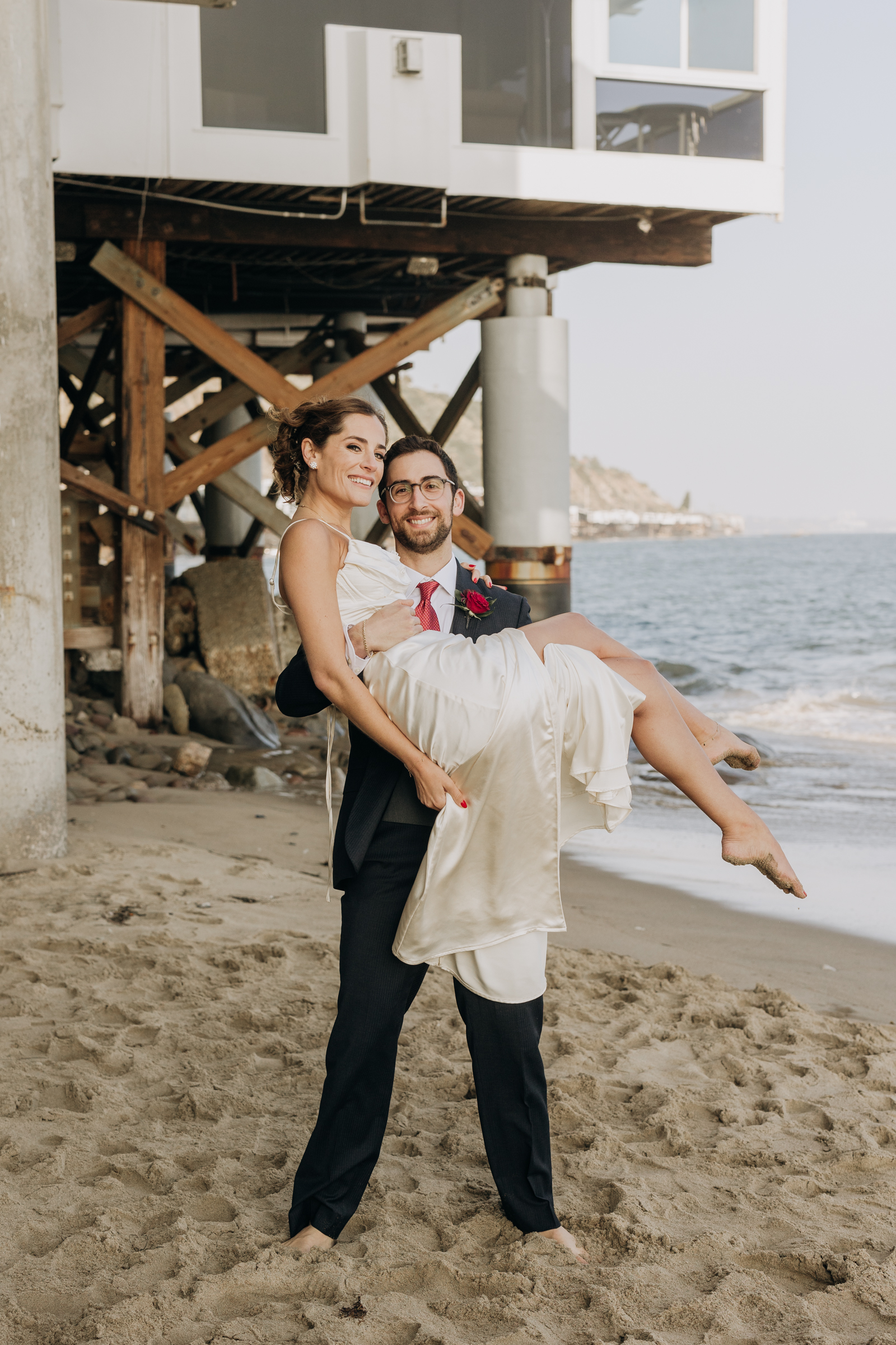 Groom carrying bride