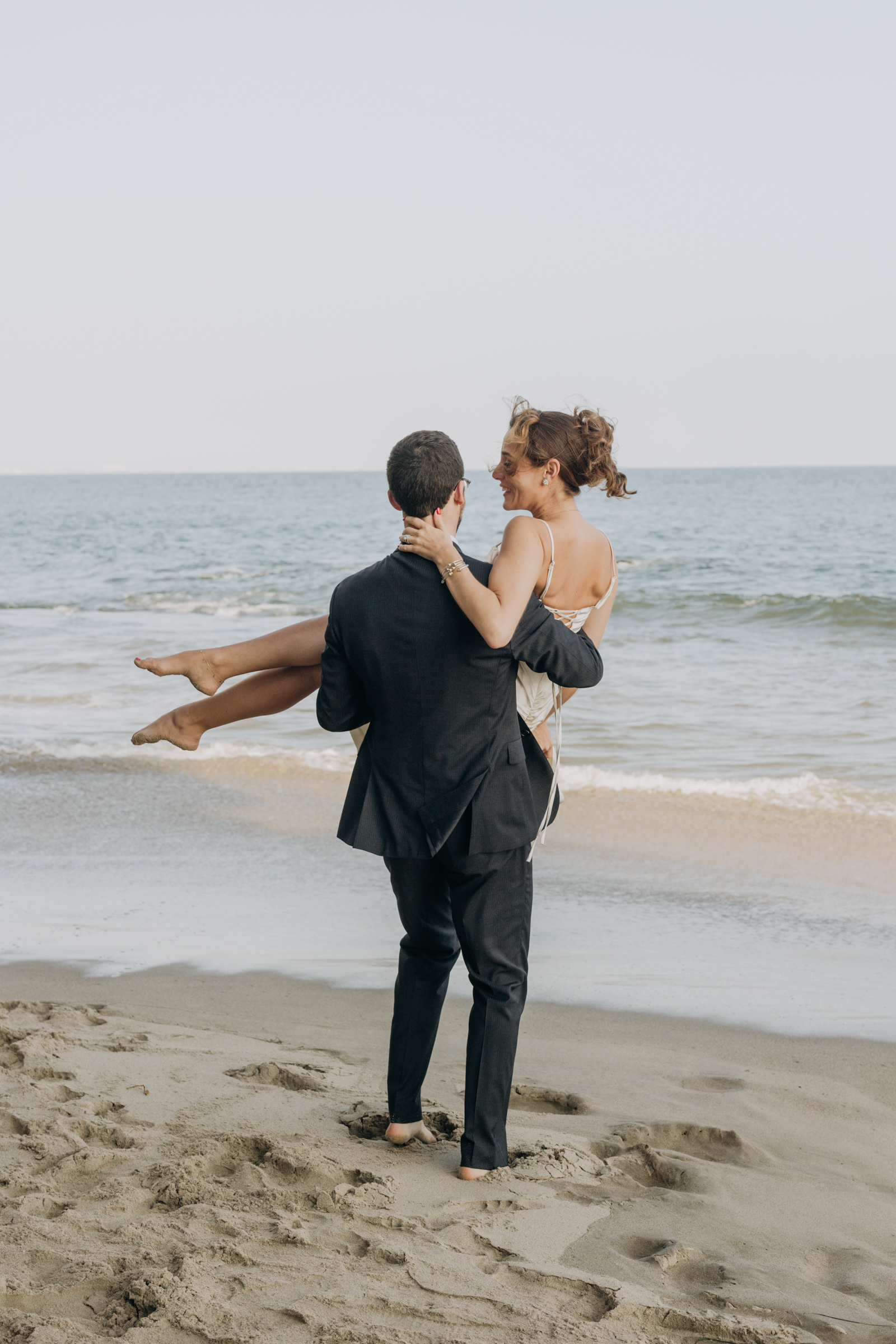 Bride and groom on beach